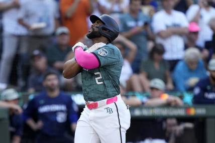 Jul 11, 2023; Seattle, Washington, USA; American League first baseman  Yandy Diaz  of the Tampa Bay Rays (2) reacts after hitting a home run during the second inning at T-Mobile Park. Mandatory Credit: Stephen Brashear-USA TODAY Sports