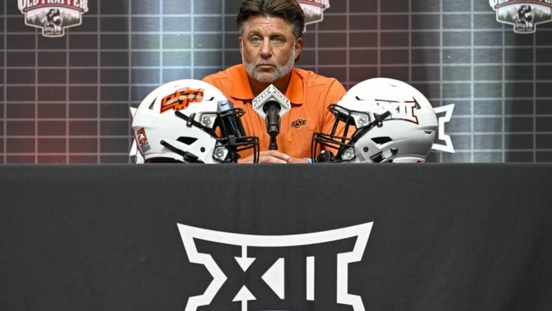 Jul 12, 2023; Arlington, TX, USA; Oklahoma State head coach Mike Gundy is interviewed during Big 12 football media day at AT&T Stadium. Mandatory Credit: Jerome Miron-USA TODAY Sports