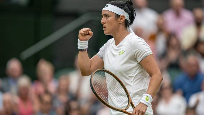 Jul 13, 2023; London, United Kingdom; Ons Jabeur (TUN) reacts to a point during her match against Aryna Sabalenka on day 11 at the All England Lawn Tennis and Croquet Club.  Mandatory Credit: Susan Mullane-USA TODAY Sports