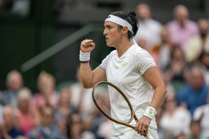 Jul 13, 2023; London, United Kingdom; Ons Jabeur (TUN) reacts to a point during her match against Aryna Sabalenka on day 11 at the All England Lawn Tennis and Croquet Club.  Mandatory Credit: Susan Mullane-USA TODAY Sports