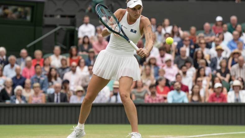 Jul 13, 2023; London, United Kingdom; Marketa Vondrousova (CZE) returns a shot during her match against Elina Svitolina (UKR) on day 11 at the All England Lawn Tennis and Croquet Club.  Mandatory Credit: Susan Mullane-USA TODAY Sports