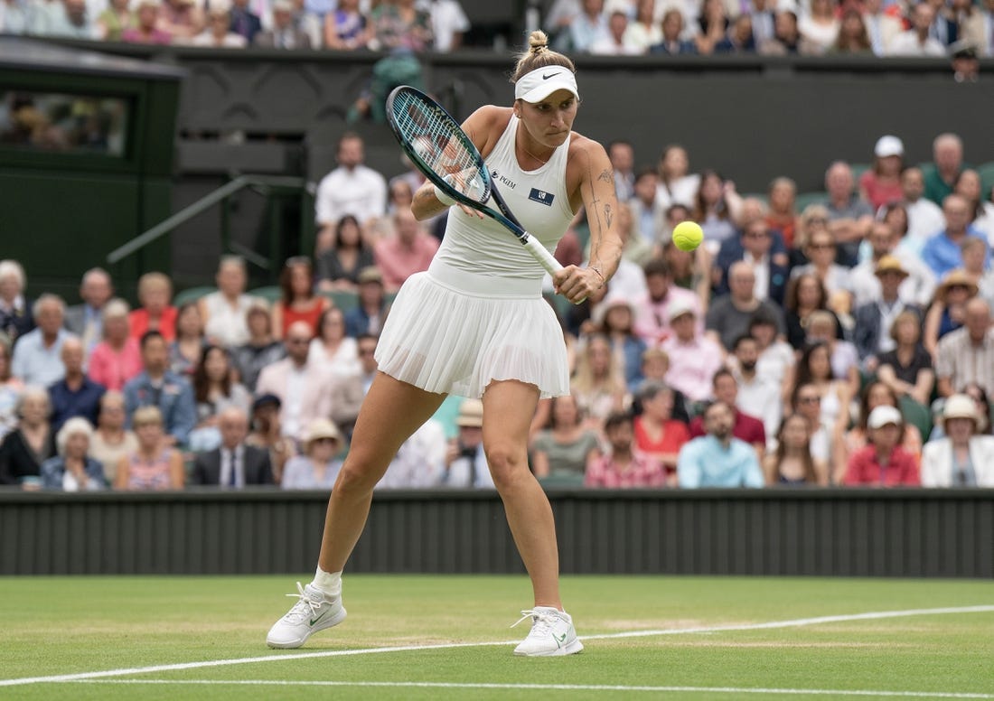 Jul 13, 2023; London, United Kingdom; Marketa Vondrousova (CZE) returns a shot during her match against Elina Svitolina (UKR) on day 11 at the All England Lawn Tennis and Croquet Club.  Mandatory Credit: Susan Mullane-USA TODAY Sports