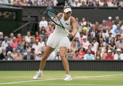 Jul 13, 2023; London, United Kingdom; Marketa Vondrousova (CZE) returns a shot during her match against Elina Svitolina (UKR) on day 11 at the All England Lawn Tennis and Croquet Club.  Mandatory Credit: Susan Mullane-USA TODAY Sports