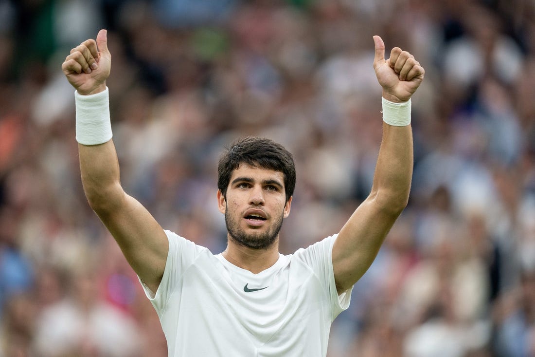 Jul 14, 2023; London, United Kingdom; Carlos Alcaraz (ESP) celebrates winning his match against Daniil Medvedev on day 12 at the All England Lawn Tennis and Croquet Club.  Mandatory Credit: Susan Mullane-USA TODAY Sports