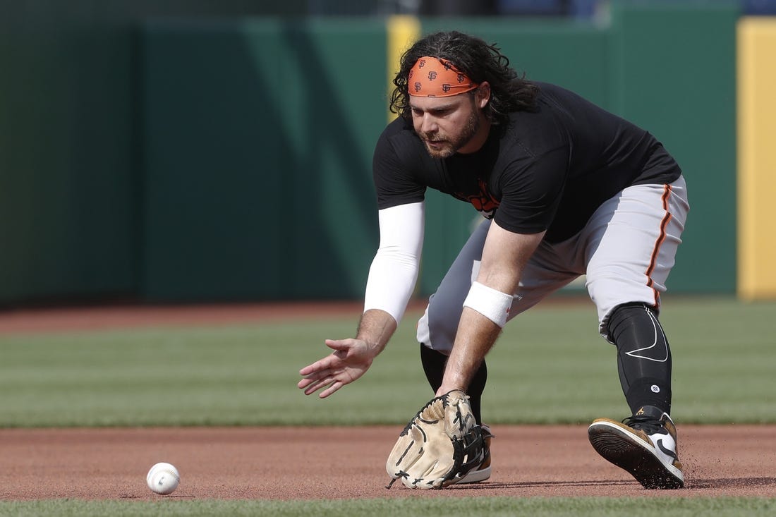 Jul 14, 2023; Pittsburgh, Pennsylvania, USA; San Francisco Giants shortstop Brandon Crawford warms up before the game against the Pittsburgh Pirates at PNC Park. Mandatory Credit: Charles LeClaire-USA TODAY Sports