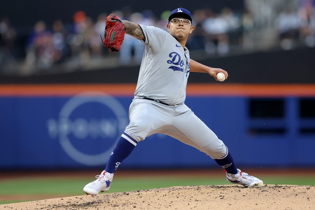 Jul 14, 2023; New York City, New York, USA; Los Angeles Dodgers starting pitcher Julio Urias (7) pitches against the New York Mets during the first inning at Citi Field. Mandatory Credit: Brad Penner-USA TODAY Sports