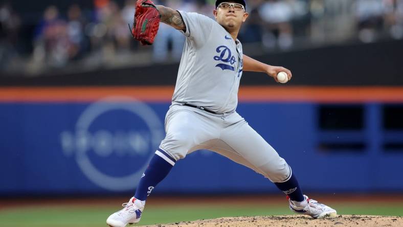 Jul 14, 2023; New York City, New York, USA; Los Angeles Dodgers starting pitcher Julio Urias (7) pitches against the New York Mets during the first inning at Citi Field. Mandatory Credit: Brad Penner-USA TODAY Sports