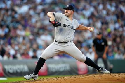 Jul 14, 2023; Denver, Colorado, USA; New York Yankees starting pitcher Carlos Rodon (55) pitches in fifth inning against the Colorado Rockies at Coors Field. Mandatory Credit: Ron Chenoy-USA TODAY Sports