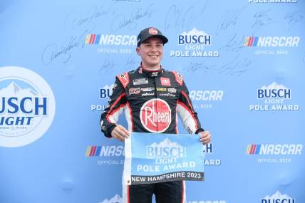 Jul 15, 2023; Loudon, New Hampshire, USA;NASCAR Cup Series driver Christopher Bell (20) celebrates winning the #1 pole position for the Crayon 301 at New Hampshire Motor Speedway. Mandatory Credit: Eric Canha-USA TODAY Sports