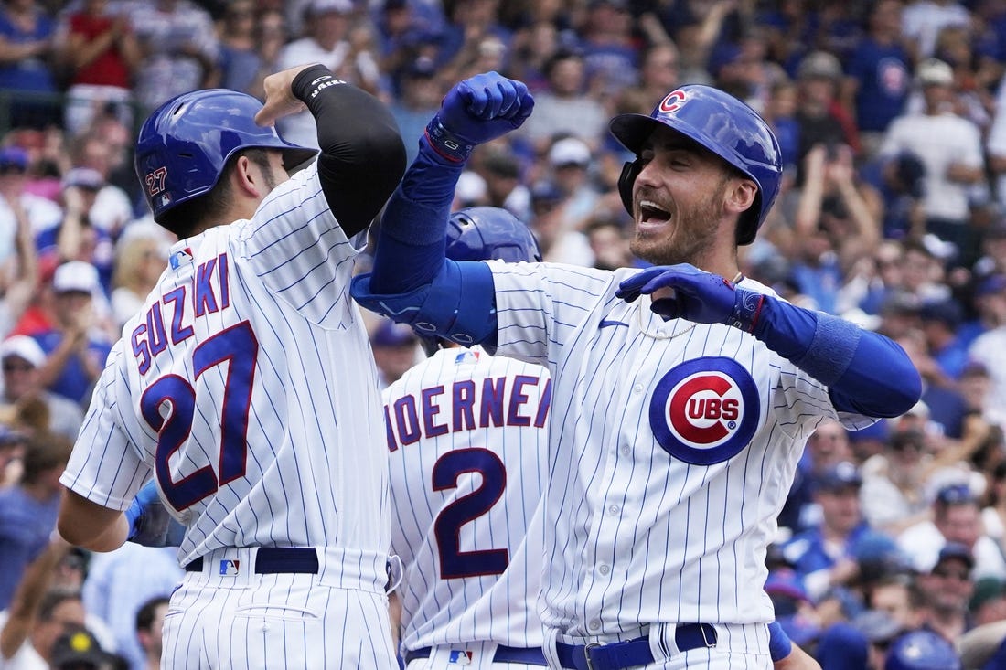 Jul 15, 2023; Chicago, Illinois, USA; Chicago Cubs center fielder Cody Bellinger (24) is greeted by right fielder Seiya Suzuki (27) after hitting a grand slam home run against the Boston Red Sox during the third inning at Wrigley Field. Mandatory Credit: David Banks-USA TODAY Sports