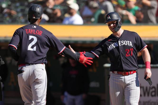 Minnesota Twins catcher Ryan Jeffers (27) hits a two run home run