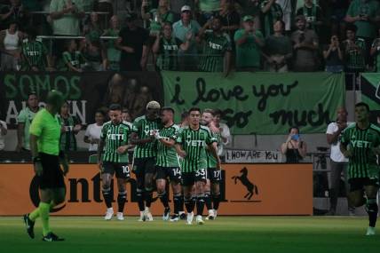 Jul 15, 2023; Austin, Texas, USA; Austin FC midfielder Ethan Finlay (13) celebrates with teammates after scoring a goal against the Sporting Kansas City during the first half at Q2 Stadium. Mandatory Credit: Scott Wachter-USA TODAY Sports