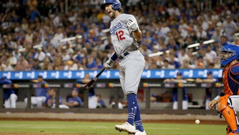 Jul 15, 2023; New York City, New York, USA; Los Angeles Dodgers outfielder Jake Marisnick (12) reacts after being hit by a pitch during the eighth inning against the New York Mets at Citi Field. Mandatory Credit: Brad Penner-USA TODAY Sports