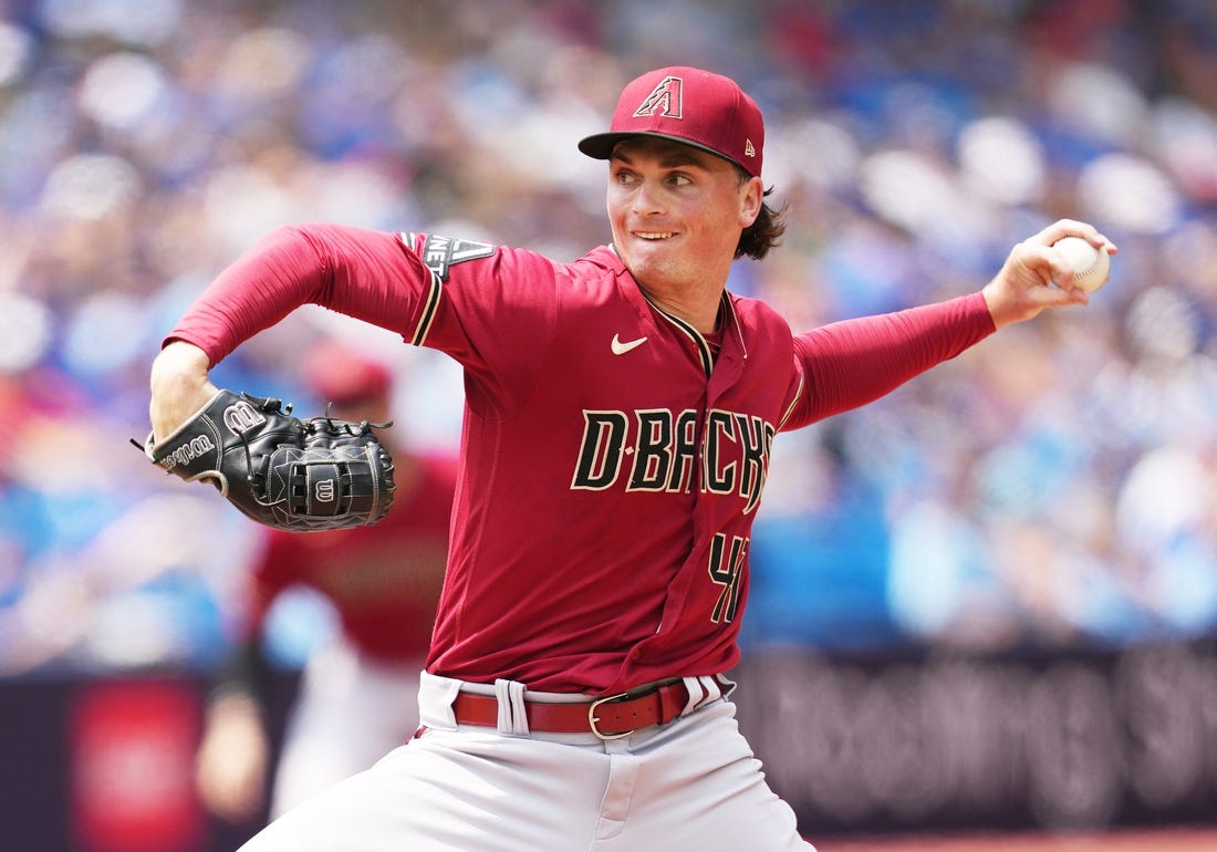 Jul 16, 2023; Toronto, Ontario, CAN; Arizona Diamondbacks starting pitcher Tommy Henry (47) throws pitch against the Toronto Blue Jays during the first inning at Rogers Centre. Mandatory Credit: Nick Turchiaro-USA TODAY Sports