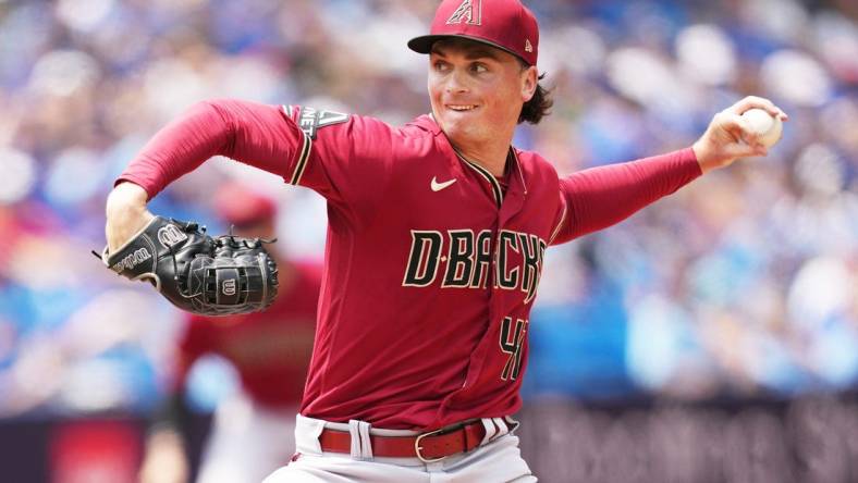 Jul 16, 2023; Toronto, Ontario, CAN; Arizona Diamondbacks starting pitcher Tommy Henry (47) throws pitch against the Toronto Blue Jays during the first inning at Rogers Centre. Mandatory Credit: Nick Turchiaro-USA TODAY Sports