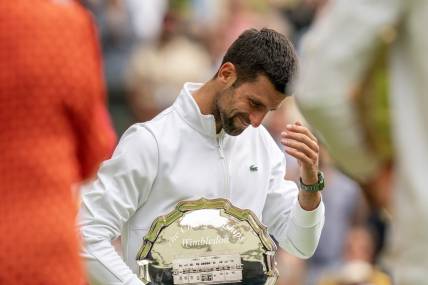 Jul 16, 2023; London, United Kingdom; Novak Djokovic (SRB) at the trophy presentation after losing the men   s singles final against Carlos Alcaraz (ESP)on day 14 at  the All England Lawn Tennis and Croquet Club. Mandatory Credit: Susan Mullane-USA TODAY Sports