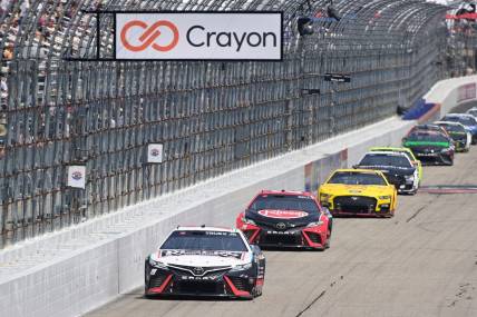 Jul 17, 2023; Loudon, New Hampshire, USA; NASCAR Cup Series driver Martin Truex Jr. (19) leads the pack down the front straightaway during the Crayon 301 at New Hampshire Motor Speedway. Mandatory Credit: Eric Canha-USA TODAY Sports