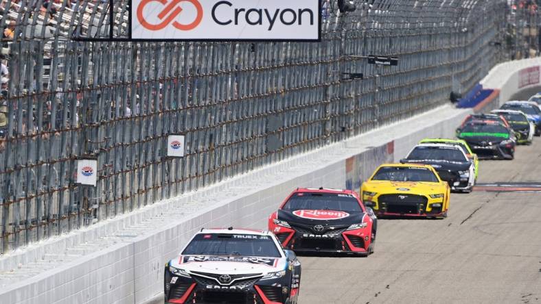 Jul 17, 2023; Loudon, New Hampshire, USA; NASCAR Cup Series driver Martin Truex Jr. (19) leads the pack down the front straightaway during the Crayon 301 at New Hampshire Motor Speedway. Mandatory Credit: Eric Canha-USA TODAY Sports