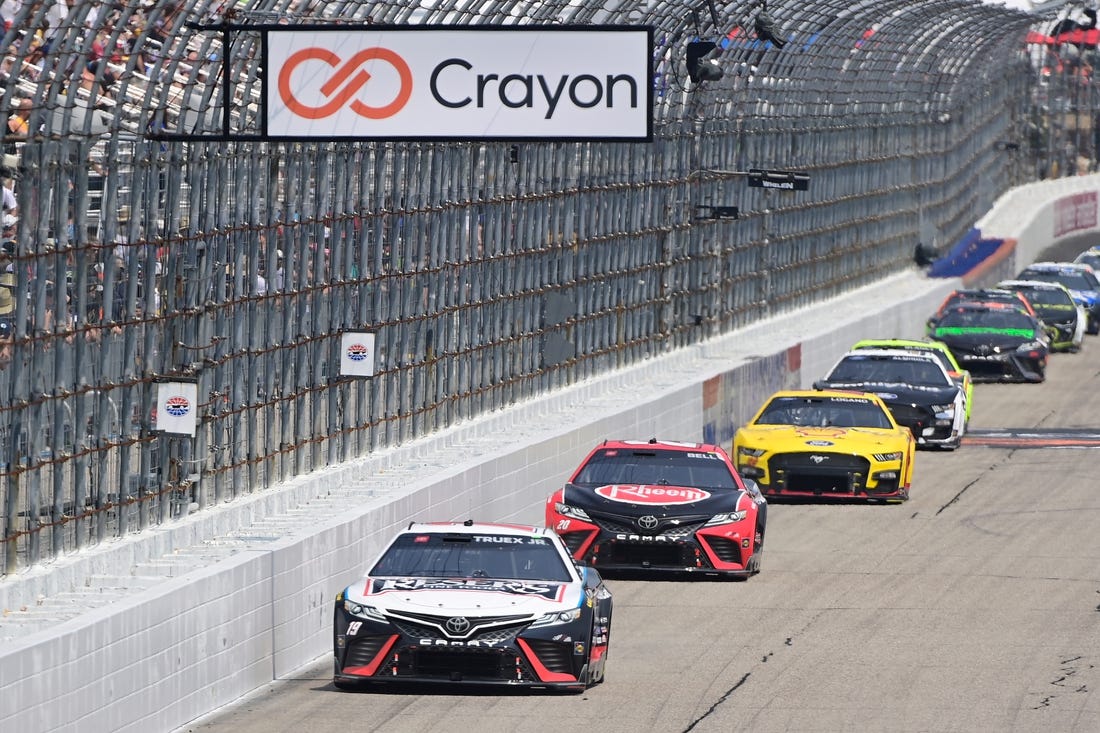 Jul 17, 2023; Loudon, New Hampshire, USA; NASCAR Cup Series driver Martin Truex Jr. (19) leads the pack down the front straightaway during the Crayon 301 at New Hampshire Motor Speedway. Mandatory Credit: Eric Canha-USA TODAY Sports