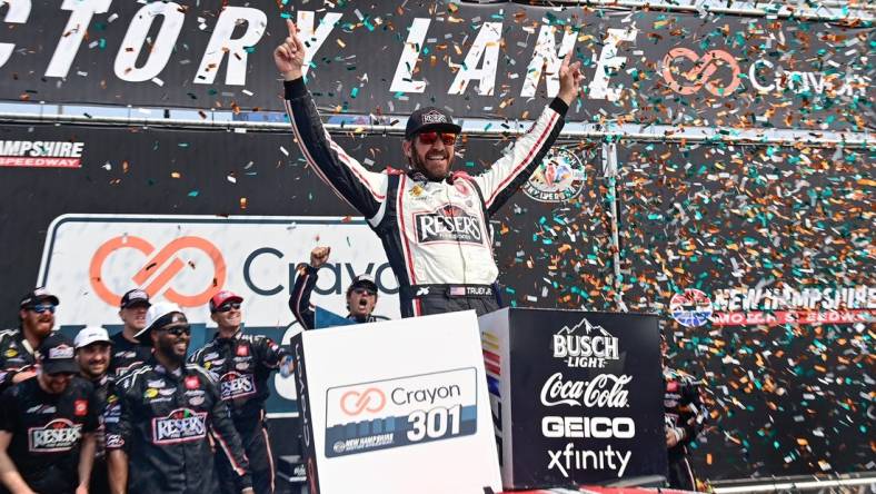 Jul 17, 2023; Loudon, New Hampshire, USA; NASCAR Cup Series driver Martin Truex Jr. (19) celebrates winning the Crayon 301 at New Hampshire Motor Speedway. Mandatory Credit: Eric Canha-USA TODAY Sports