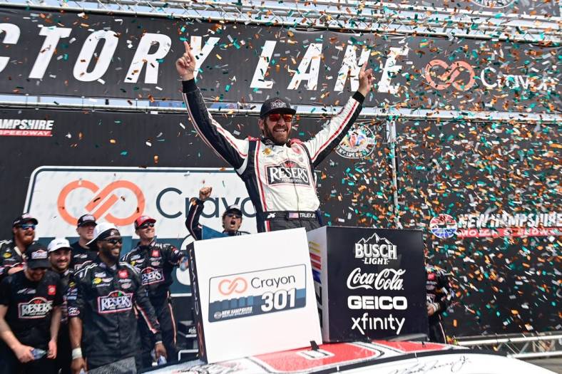 Jul 17, 2023; Loudon, New Hampshire, USA; NASCAR Cup Series driver Martin Truex Jr. (19) celebrates winning the Crayon 301 at New Hampshire Motor Speedway. Mandatory Credit: Eric Canha-USA TODAY Sports