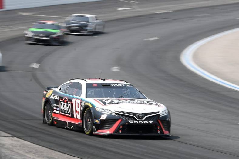 Jul 17, 2023; Loudon, New Hampshire, USA; NASCAR Cup Series driver Martin Truex Jr. (19) races into turn two during the Crayon 301 at New Hampshire Motor Speedway. Mandatory Credit: Eric Canha-USA TODAY Sports