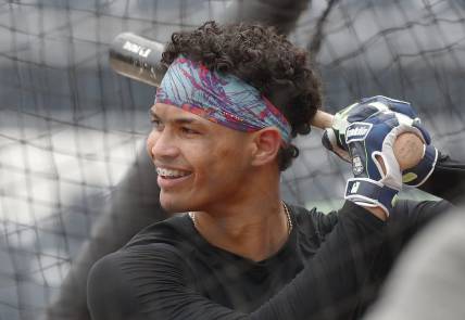 Jul 17, 2023; Pittsburgh, Pennsylvania, USA;  Pittsburgh Pirates catcher Endy Rodriguez (25) takes his turn in the batting cage before the game against the Cleveland Guardians at PNC Park. Mandatory Credit: Charles LeClaire-USA TODAY Sports