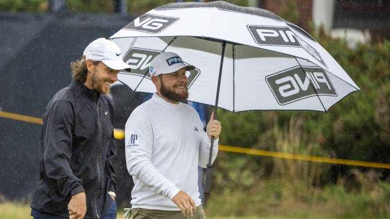 July 18, 2023; Hoylake, ENGLAND, GBR; Tommy Fleetwood (left) and Tyrrell Hatton (right) talk on the fourth hole during a practice round of The Open Championship golf tournament at Royal Liverpool. Mandatory Credit: Kyle Terada-USA TODAY Sports