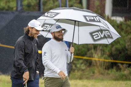 July 18, 2023; Hoylake, ENGLAND, GBR; Tommy Fleetwood (left) and Tyrrell Hatton (right) talk on the fourth hole during a practice round of The Open Championship golf tournament at Royal Liverpool. Mandatory Credit: Kyle Terada-USA TODAY Sports