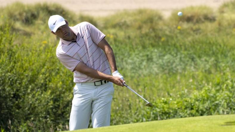 July 19, 2023; Hoylake, ENGLAND, GBR; Scottie Scheffler hits a chip shot on the 17th hole during a practice round of The Open Championship golf tournament at Royal Liverpool. Mandatory Credit: Kyle Terada-USA TODAY Sports