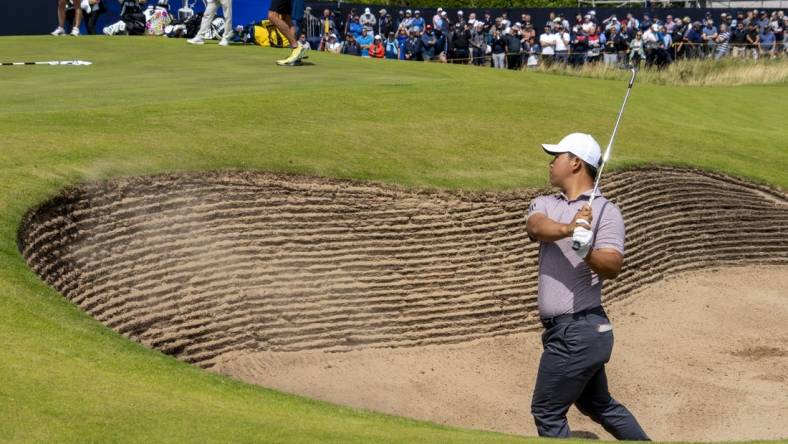 July 19, 2023; Hoylake, ENGLAND, GBR; Tom Kim hits out of the bunker on the 17th hole during a practice round of The Open Championship golf tournament at Royal Liverpool. Mandatory Credit: Kyle Terada-USA TODAY Sports