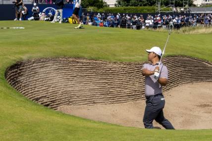 July 19, 2023; Hoylake, ENGLAND, GBR; Tom Kim hits out of the bunker on the 17th hole during a practice round of The Open Championship golf tournament at Royal Liverpool. Mandatory Credit: Kyle Terada-USA TODAY Sports