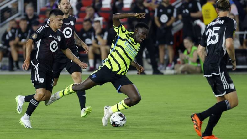 Jul 19, 2023; Washington, DC, USA; MLS midfielder Thiago Almada (23) of Atlanta United fouls Arsenal midfielder Bukayo Saka (7) during the first half of the 2023 MLS All Star Game at Audi Field. Mandatory Credit: Geoff Burke-USA TODAY Sports