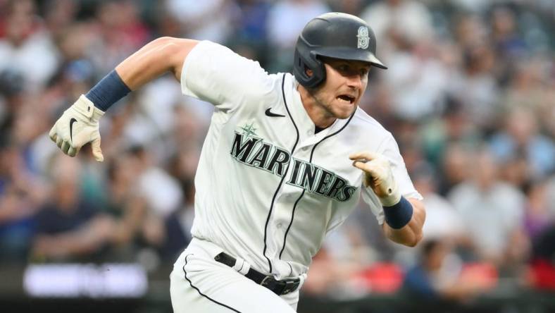 Jul 19, 2023; Seattle, Washington, USA; Seattle Mariners left fielder Jarred Kelenic (10) runs toward first base after hitting a single against the Minnesota Twins during the seventh inning at T-Mobile Park. Mandatory Credit: Steven Bisig-USA TODAY Sports