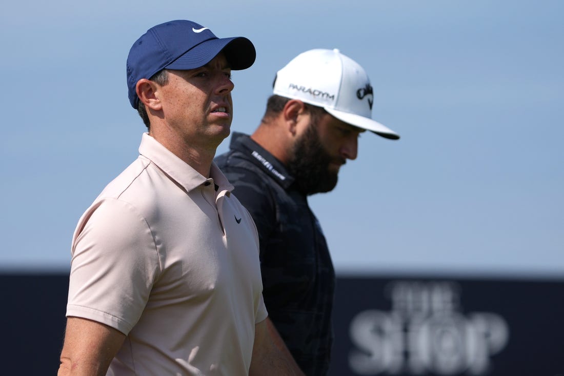 July 20, 2023; Hoylake, England, GBR; Rory McIlroy (left) and Jon Rahm look on during the first round of The Open Championship golf tournament at Royal Liverpool. Mandatory Credit: Kyle Terada-USA TODAY Sports