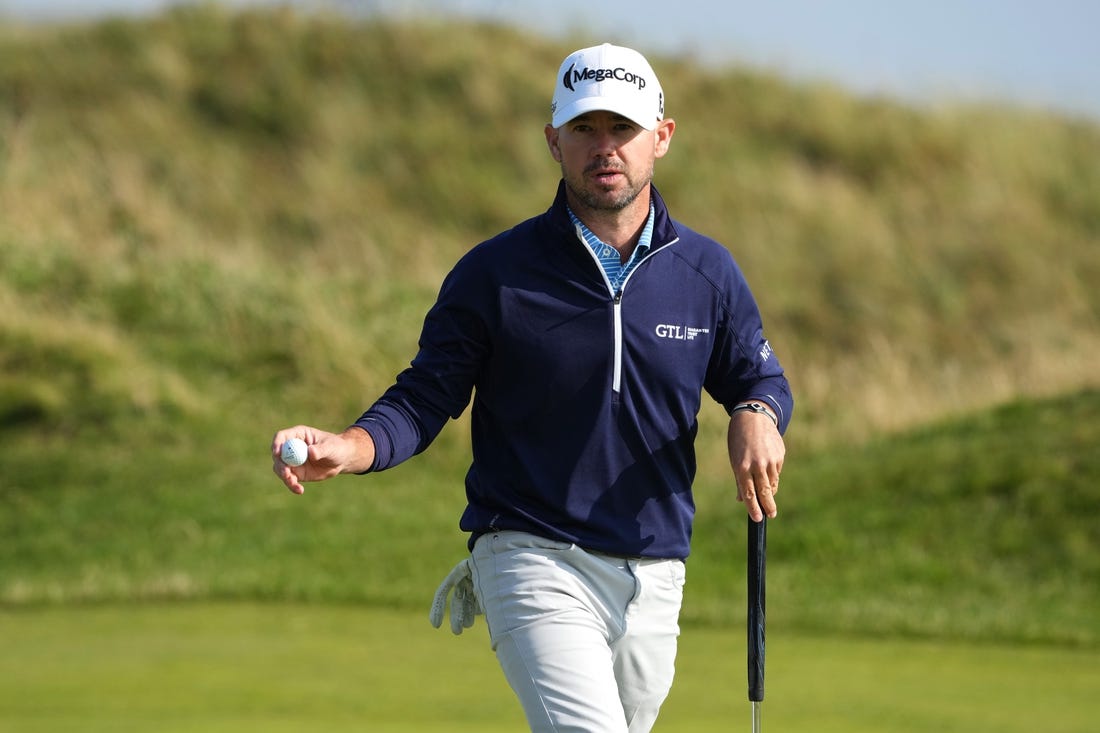 July 20, 2023; Hoylake, England, GBR; Brian Harman acknowledges the crowd after a putt during the first round of The Open Championship golf tournament at Royal Liverpool. Mandatory Credit: Kyle Terada-USA TODAY Sports