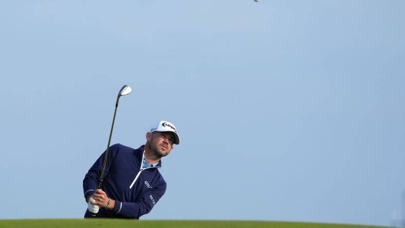 July 20, 2023; Hoylake, England, GBR; Brian Harman plays a shot onto the 17th green during the first round of The Open Championship golf tournament at Royal Liverpool. Mandatory Credit: Kyle Terada-USA TODAY Sports