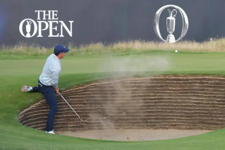 July 20, 2023; Hoylake, England, GBR; Rory McIlroy plays a shot from a bunker on the 18th hole during the first round of The Open Championship golf tournament at Royal Liverpool. Mandatory Credit: Kyle Terada-USA TODAY Sports