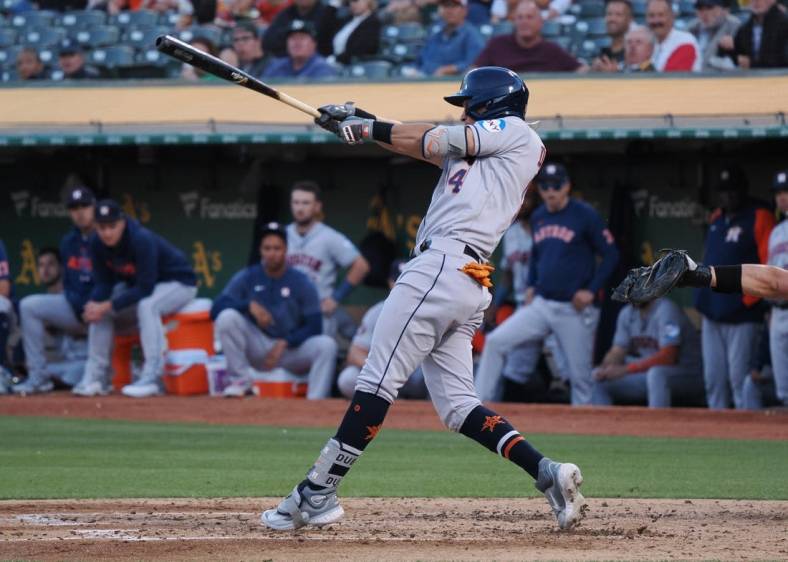 Houston Astros second baseman Mauricio Dubon (14) batting in the