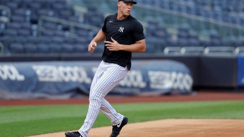 Jul 21, 2023; Bronx, New York, USA; New York Yankees injured outfielder Aaron Judge (99) works out before a game against the Kansas City Royals at Yankee Stadium. Mandatory Credit: Brad Penner-USA TODAY Sports