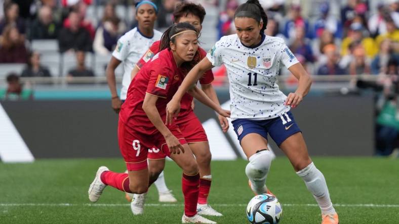 Jul 22, 2023; Auckland, NZL; USA forward Sophia Smith (11) gets the ball past Vietnam forward Huynh Nhu (9) in the second half of a group stage match in the 2023 FIFA Women's World Cup at Eden Park. Mandatory Credit: Jenna Watson-USA TODAY Sports