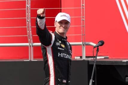 Jul 22, 2023; Newton, Iowa, USA; Team Penske driver Josef Newgarden of the United States celebrates winning the Hy-Vee Homefront 250 at the Iowa Speedway. Mandatory Credit: Reese Strickland-USA TODAY Sports