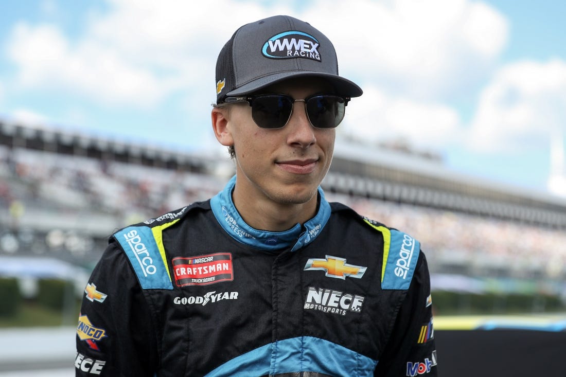 Jul 22, 2023; Long Pond, Pennsylvania, USA; NASCAR Craftsman Truck Series driver Carson Hocevar stands on pit road prior to the CRC Brakleen 150 at Pocono Raceway. Mandatory Credit: Matthew O'Haren-USA TODAY Sports