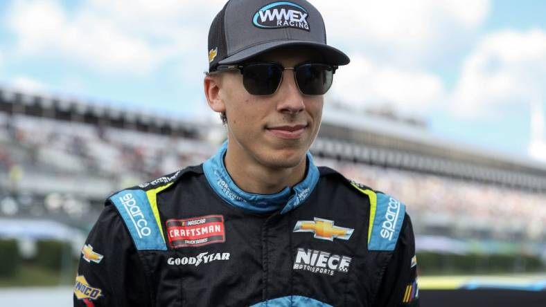 Jul 22, 2023; Long Pond, Pennsylvania, USA; NASCAR Craftsman Truck Series driver Carson Hocevar stands on pit road prior to the CRC Brakleen 150 at Pocono Raceway. Mandatory Credit: Matthew O'Haren-USA TODAY Sports