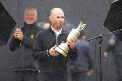 Jul 23, 2023; Hoylake, England, GBR; Brian Harman holds the Claret Jug after winning The Open Championship golf tournament. Mandatory Credit: Kyle Terada-USA TODAY Sports