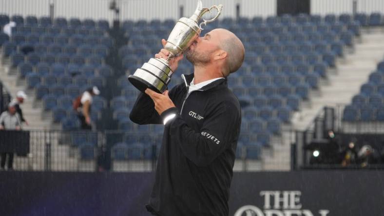 Jul 23, 2023; Hoylake, England, GBR; Brian Harman kisses the Claret Jug after winning The Open Championship golf tournament. Mandatory Credit: Kyle Terada-USA TODAY Sports