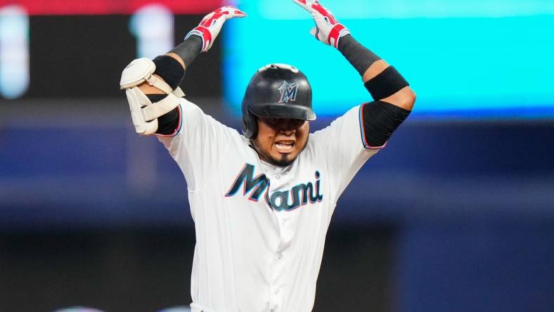 Jul 23, 2023; Miami, Florida, USA; Miami Marlins second baseman Luis Arraez (3) celebrates hitting a double against the Colorado Rockies during the sixth inning at loanDepot Park. Mandatory Credit: Rich Storry-USA TODAY Sports