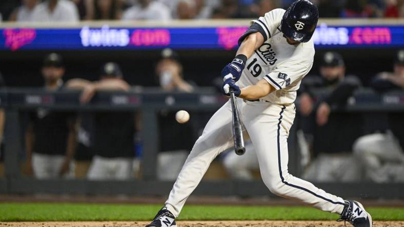 Jul 24, 2023; Minneapolis, Minnesota, USA;  Minnesota Twins infielder Alex Kirilloff (19) hits a double against the Seattle Mariners during the ninth inning at Target Field. Mandatory Credit: Nick Wosika-USA TODAY Sports