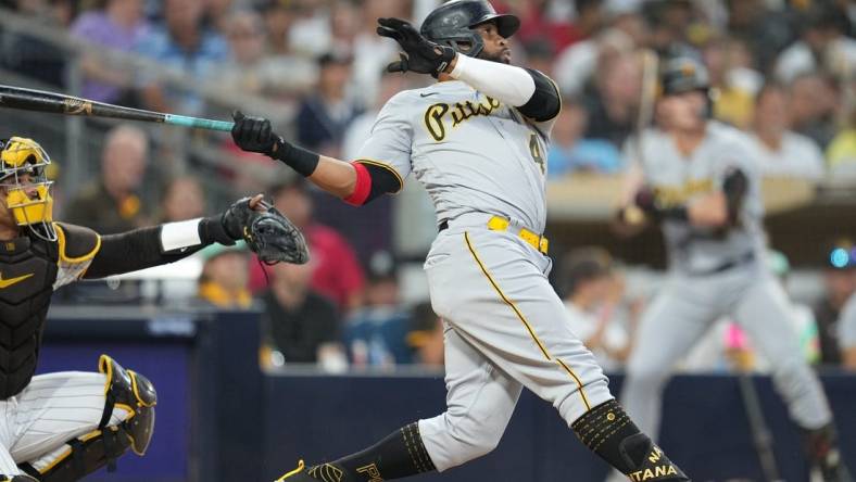 Jul 24, 2023; San Diego, California, USA;  Pittsburgh Pirates first baseman Carlos Santana (41) hits a home run against the San Diego Padres during the fifth inning at Petco Park. Mandatory Credit: Ray Acevedo-USA TODAY Sports