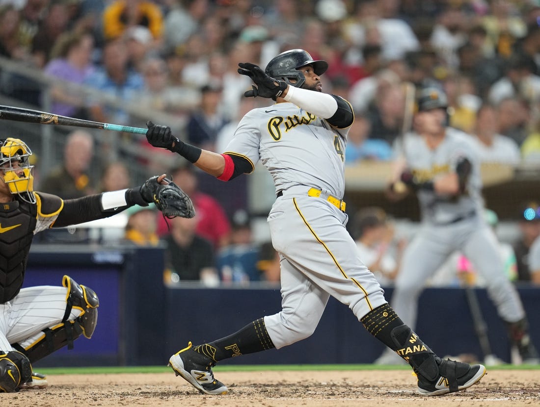 Jul 24, 2023; San Diego, California, USA;  Pittsburgh Pirates first baseman Carlos Santana (41) hits a home run against the San Diego Padres during the fifth inning at Petco Park. Mandatory Credit: Ray Acevedo-USA TODAY Sports